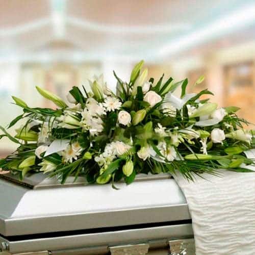 Funeral Arrangement Covers Box With White Roses and Lilies
